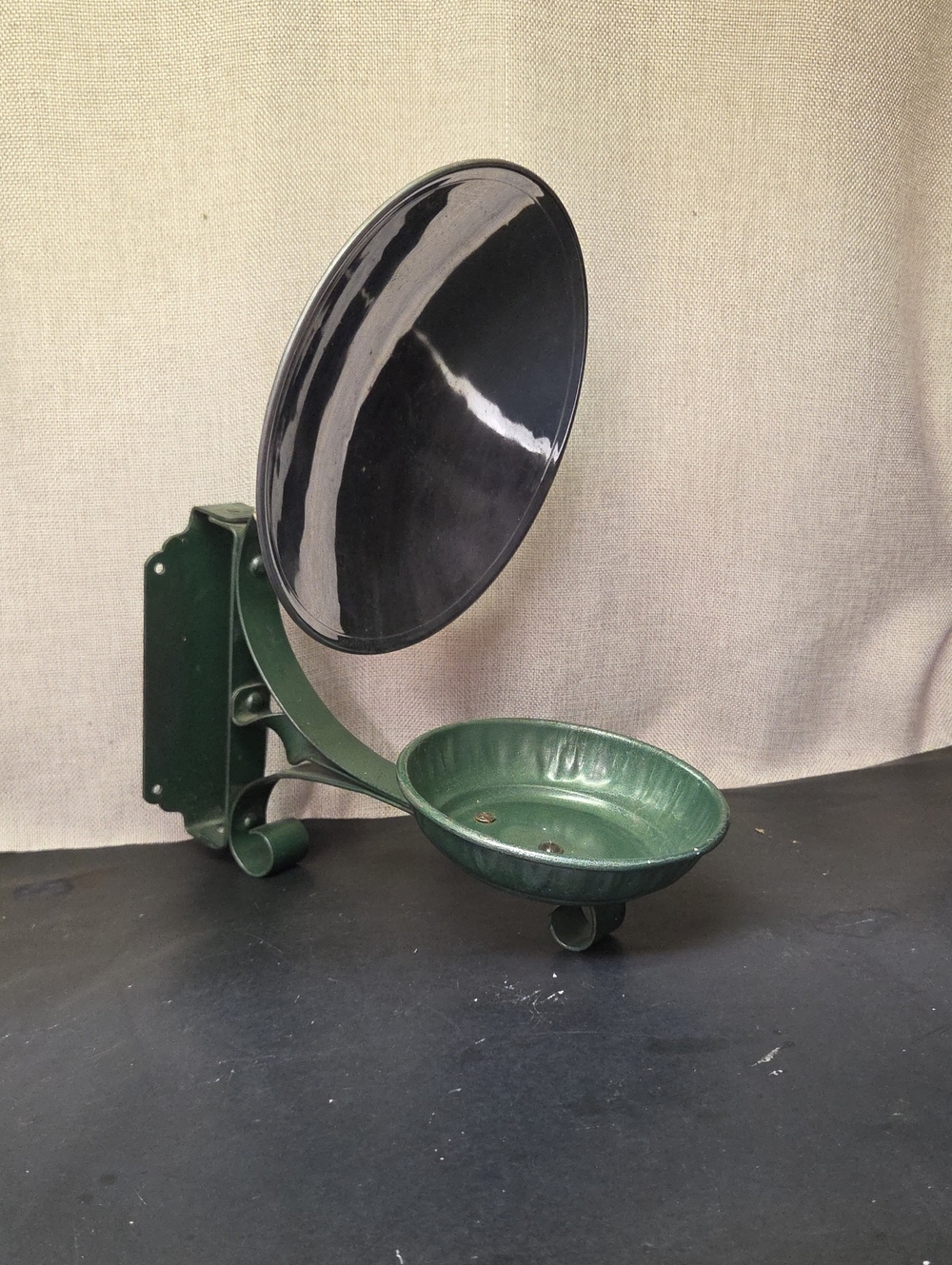 antique‎ cast iron Oil Lamp sconce with a built-in metal reflector.